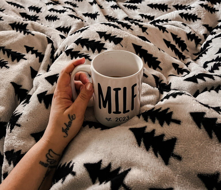 morning rest in bed for mom with coffee and train track in the background